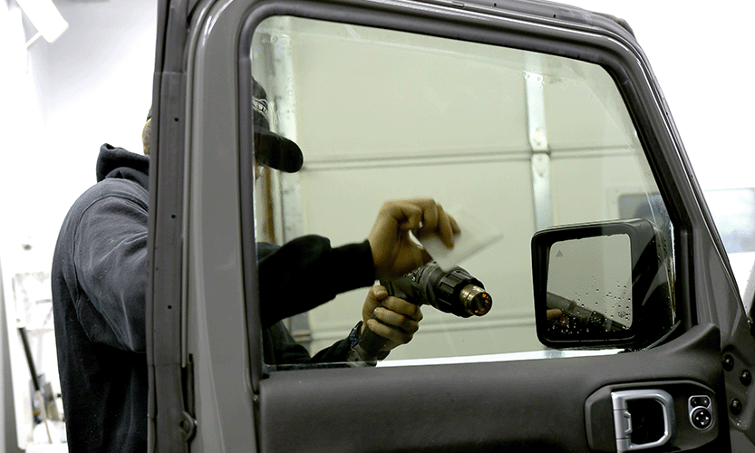 Prestige Auto Appearance technician installing premium window tint in Allentown PA