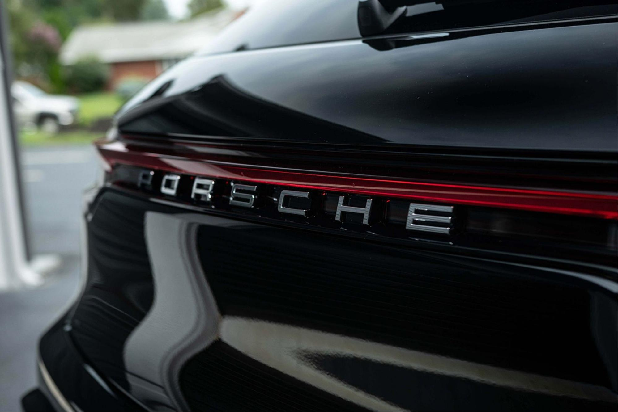 Close-up of a black Porsche with paint protection film applied by Prestige Auto Appearance.