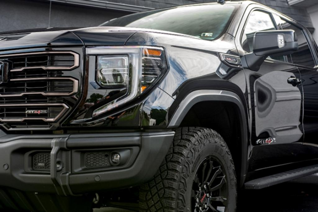 Black GMC Sierra AT4 truck with a high-gloss finish after ceramic coating.