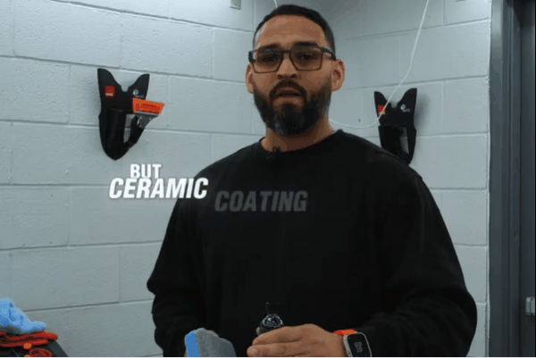 Technician holding ceramic coating applicator with text overlay saying "Ceramic Coating is the Next Level."