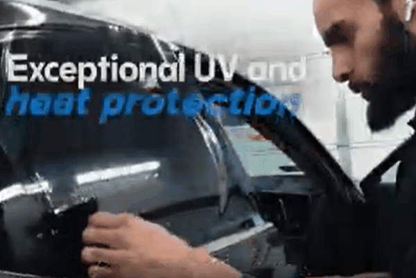 Technician installing automotive window tint film with text highlighting UV and heat protection benefits.