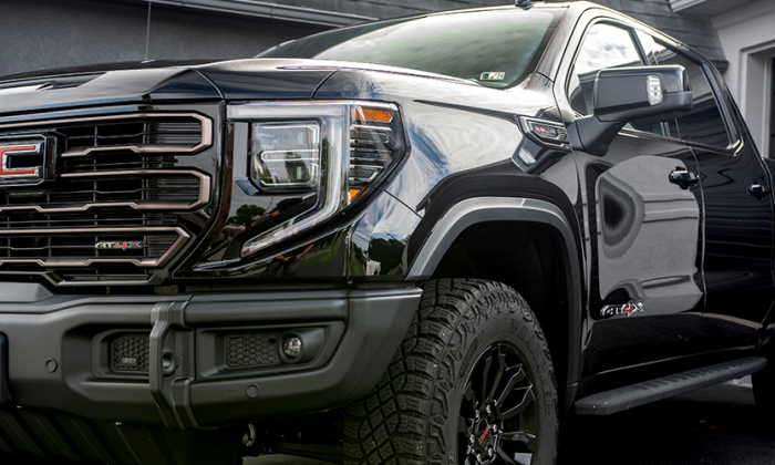 Glossy black GMC Sierra reflecting sunlight after ceramic coating at Prestige Auto Appearance in Allentown PA